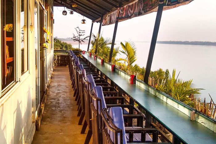 Admire the river scenery while eating at Jasmine Boat Restaurant in Kratie