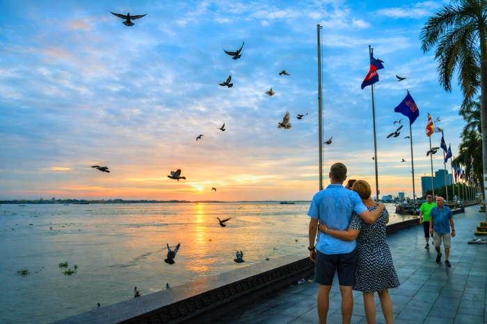 Moments for two facing the sunset in Phnom Penh when traveling to Cambodia