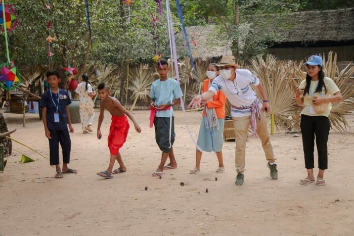 Participate in traditional Khmer games