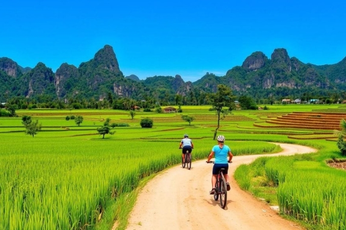 Cycling through rice paddies and karst mountains in Vang Vieng