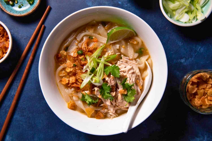 A steaming bowl of Khao Piak Sen, Lao rice noodle soup
