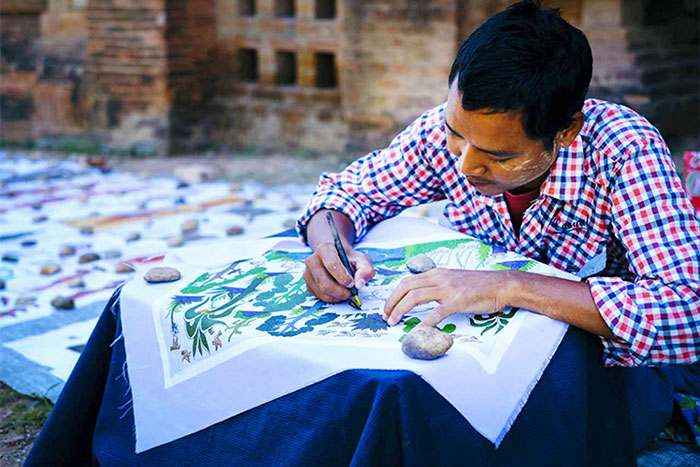 The process of making a sand painting 
