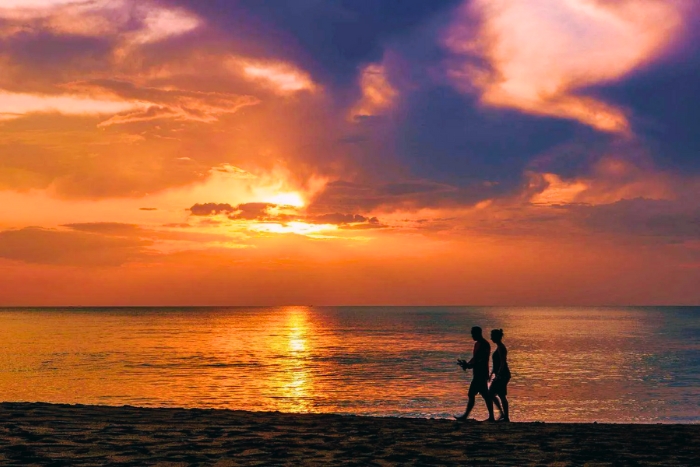 Enjoying a quiet sunset walk at Phra Ae Beach