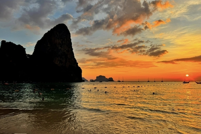 Watch a magical sunset at Railay Beach