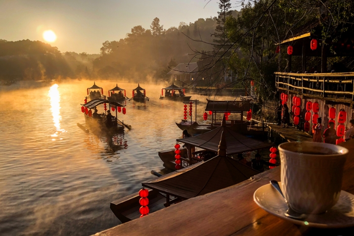 Take a boat trip on the lake in Ban Rak Thai village