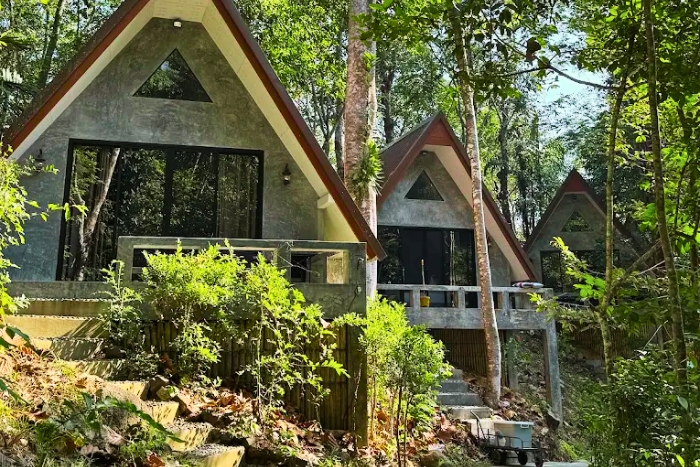 Baan Rai Me Rak Organic Farmstay surrounded by tropical greenery
