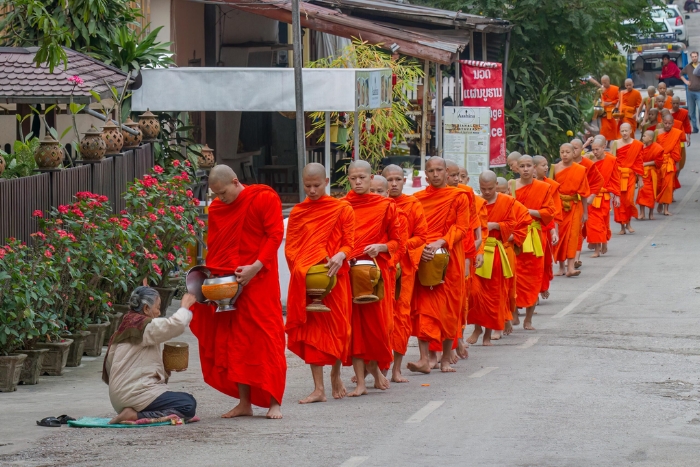 Tak Bat - morning alms giving ceremony in Laos