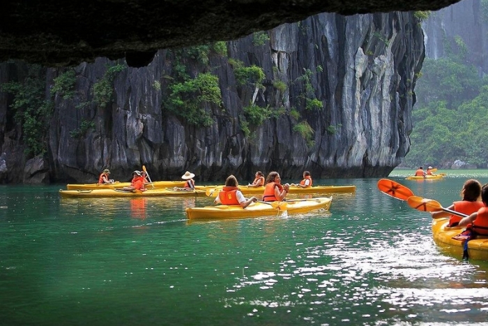 Kayaking between the limestone peaks of Halong