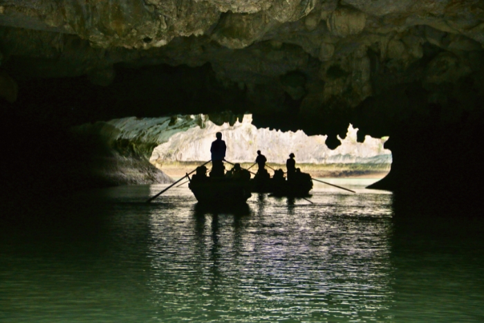 Rowing bamboo boat to explore Dark and Bright Cave