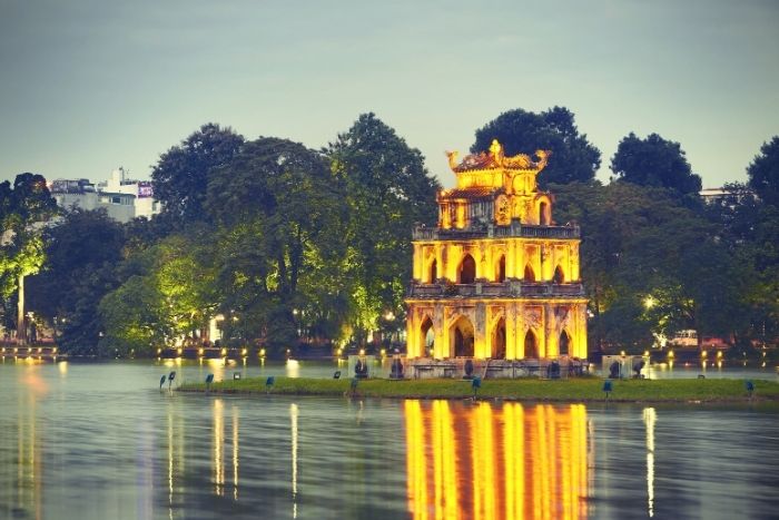 Hanoi evenings come alive around Hoan Kiem Lake, blending calm waters and vibrant streets