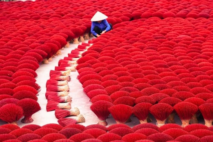 In Quang Phu Cau village, red incense sticks produce visually stunning, photogenic scenes