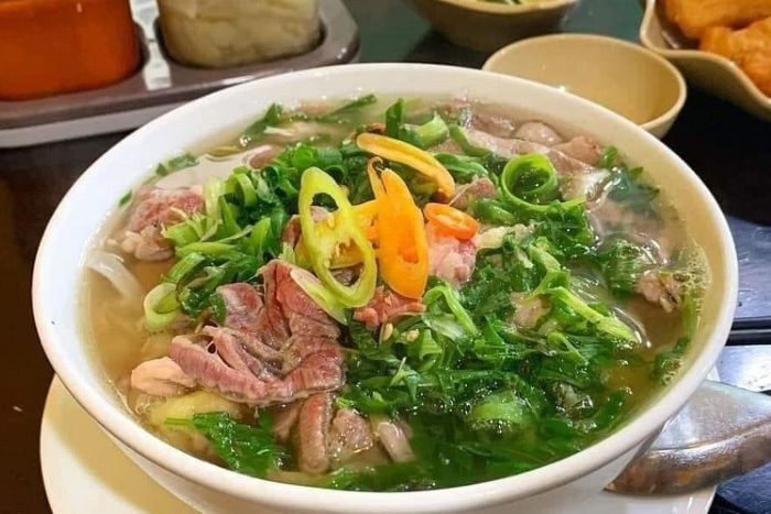The beef is sautéed before being added to the pho bowl