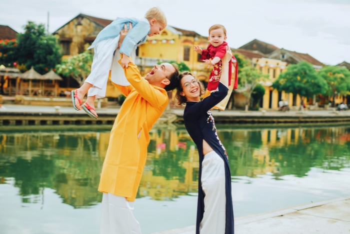 Wearing traditional Ao Dai for a Vietnam family itinerary