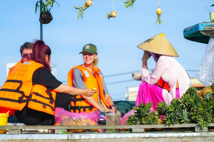 Immerse yourself in the vibrant morning rhythm at the floating market