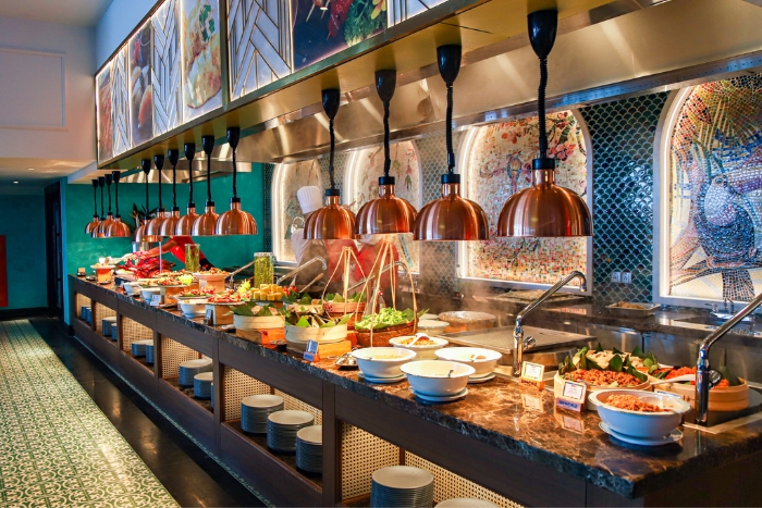 Enjoying a delicious buffet lunch to recharge during Ba Na Hills 1 day trip adventure
