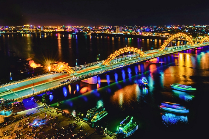 Watching Dragon Bridge at night is one of the top things to do in Da Nang
