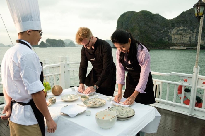 Participate in cooking class on boat