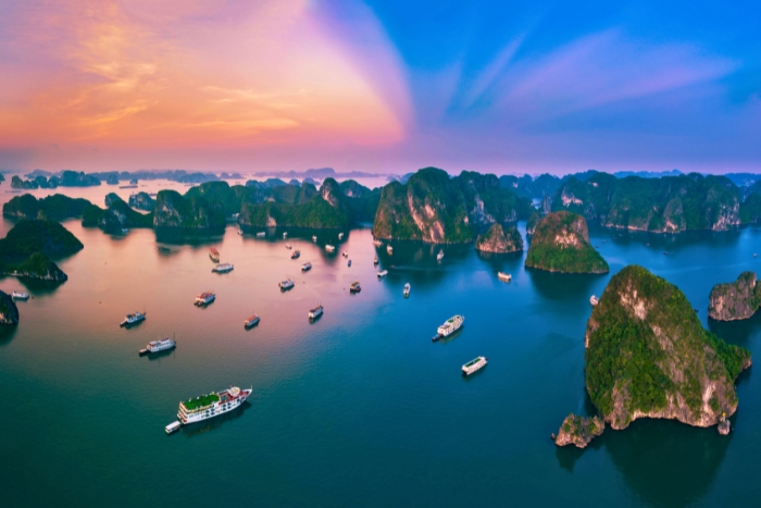 Sunset colors glow over Halong Bay waters
