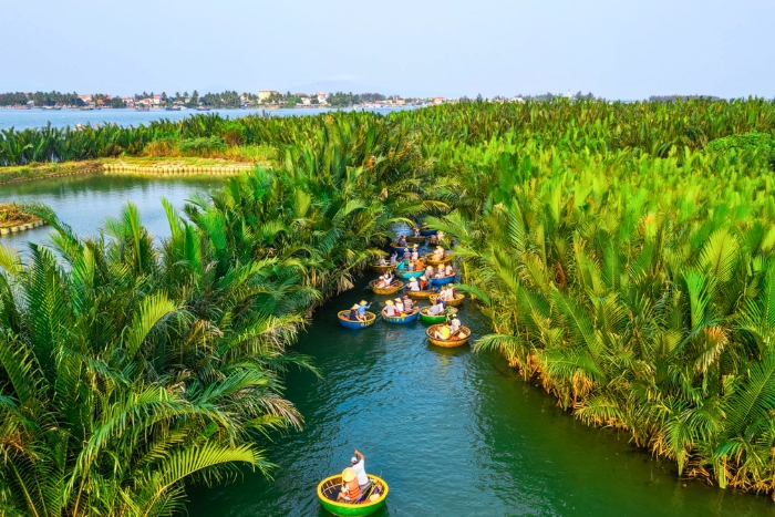 Peaceful basket boat ride through Bay Mau coconut forest