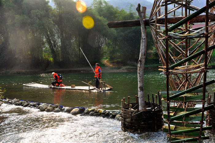 A peaceful bamboo raft ride along the river in Pu Luong