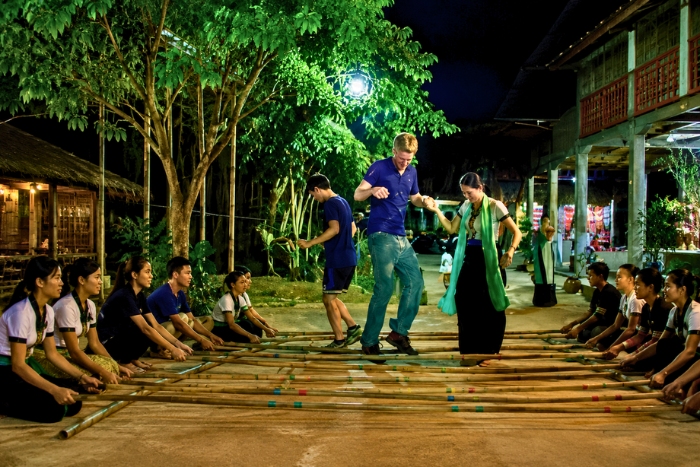 Taking part in the bamboo dance during an evening in Mai Chau