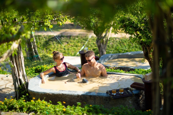 Relaxing moment with a mud bath at Hon Tam