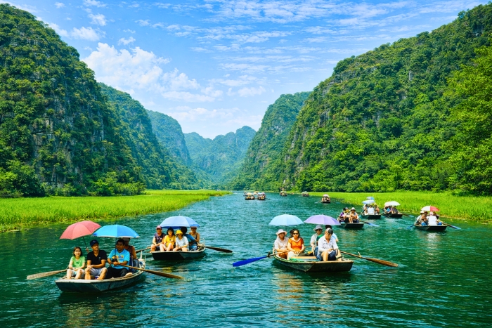 Karst landscapes and rice fields during a boat ride to visit Tam Coc Ninh Binh