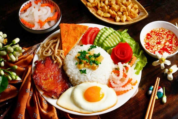 Delicious Cơm Tấm showing affordable Vietnam 10 days budget