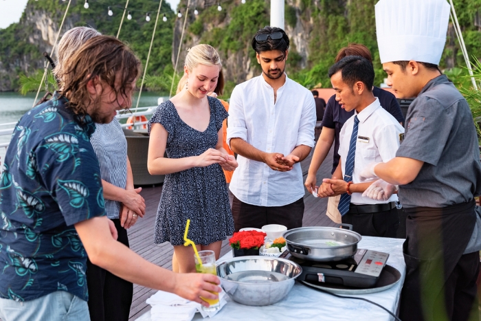 Travelers join a fun cooking class at sunset