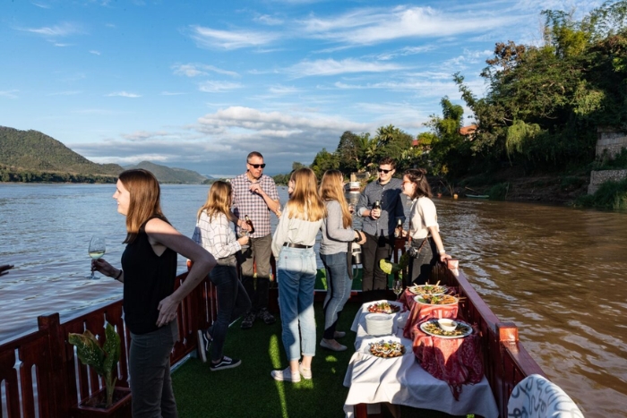 Enjoy peaceful ambiance on Mekong river cruise in Laos