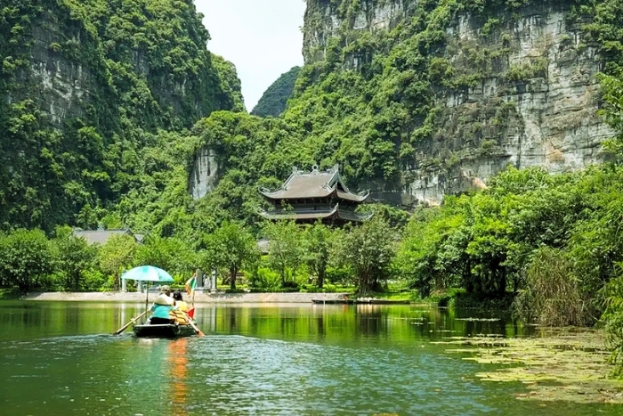 Exploring Trang An by boat in the heart of the nature in Vietnam in March