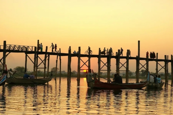 Walking U Bein Bridge at sunset - Timeless view in one of the top places to visit in March